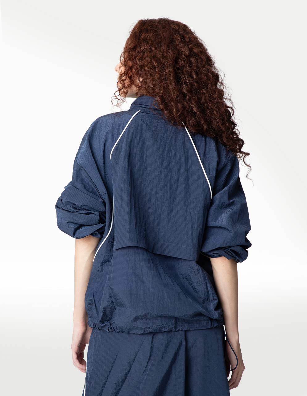 Chamarra New Balance Sport Legacy Azul - Mujer